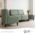 Green sofa set in a room with a coffee table and flowers, featuring J&L Healthcare Furniture logo.